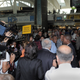 Mob scene at JFK Airport as Strauss-Kahn heads for home.